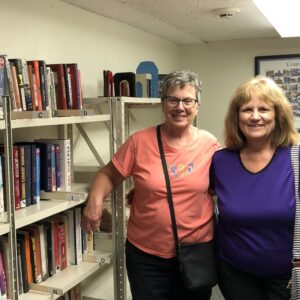 Becky and Patty moved the book sale up to the vault.