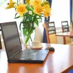 flowers on table beside computer